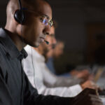 Cips Level 4 Diploma In Procurement And Supply 1 Focused Call Center Operator Typing On Laptop
