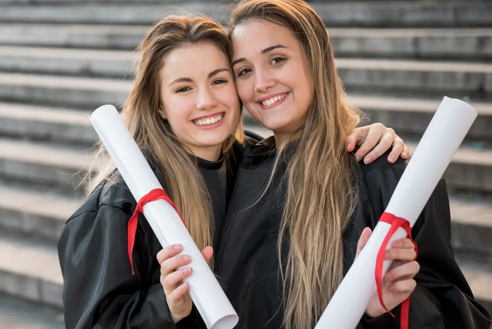 Front View Girls Holding Their College Certificates 1