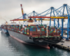 Large cargo ships at busy port