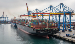 Large cargo ships at busy port